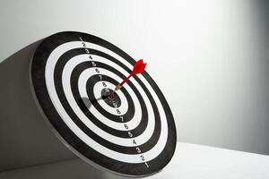 red dart hitting target background photo