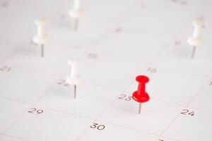 detail of calendar with red and white pin background photo