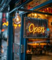 Rusty Open Sign Hanging in Rainy Window photo