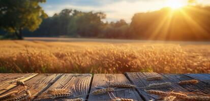 Wooden Plank Surface With Golden Wheat Field and Sunset in Background photo