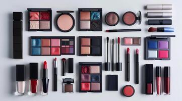 Assortment of Black Compact Makeup Products Arranged on a White Surface photo