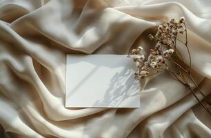 Blank White Envelope on Knit Fabric With Dried Flowers photo