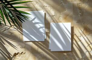 White Paper Mockup With Palm Leaf Shadows on Beige Fabric photo