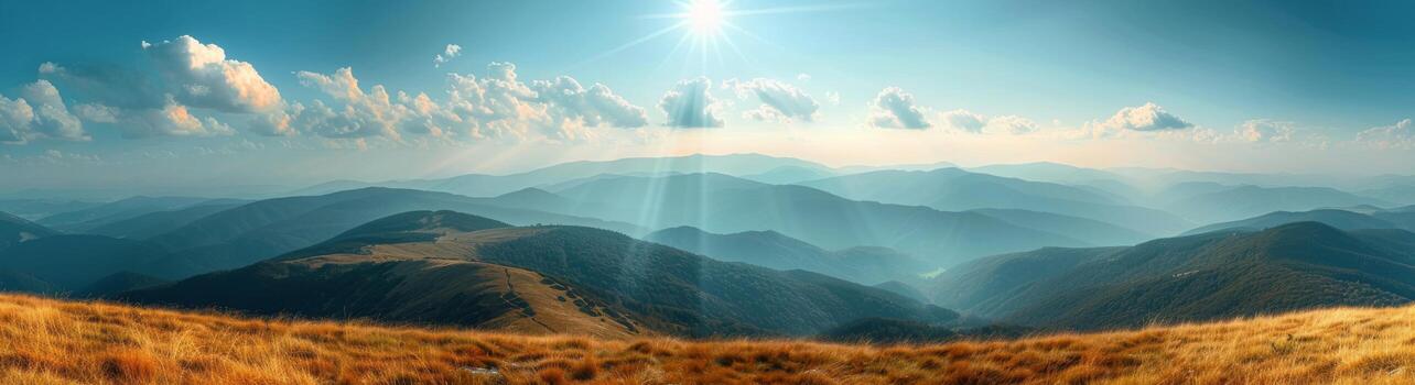 Sunny Day View Over Mountain Range With Golden Grass photo