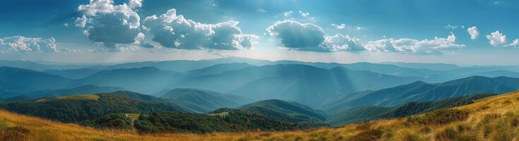 Sunny Day View Over Mountain Range With Golden Grass photo