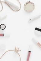Frame background with flatley cosmetics on white. Makeup accessories lipstick mascara top view in pastel colors. Vertical template with copy space photo