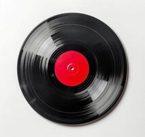 A Worn Vinyl Record With A Red Label On A White Background photo