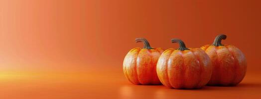 Three Pumpkins on an Orange Background photo