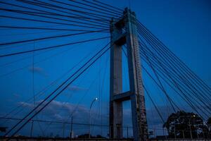 a bridge with a tower photo