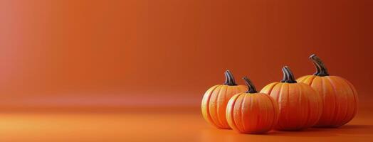 Three Pumpkins on an Orange Background photo