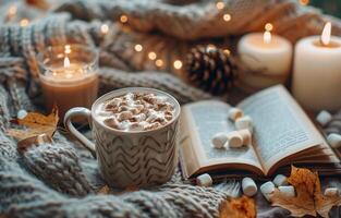 Cozy Autumn Evening With Hot Chocolate, Book, and Candles photo