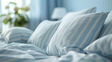 Bed With Blue and White Sheets and Pillows photo