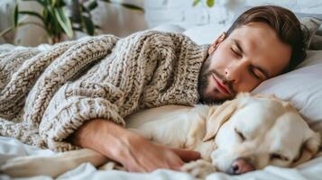 Person Relaxing in Bed With Dog photo