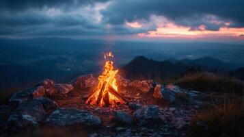 Fire Burning in Field With Mountains in Background photo