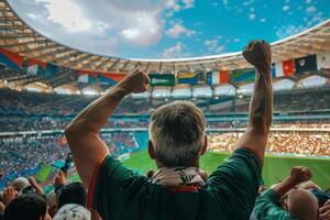 Fans Fist Pump During a Soccer Game at a Stadium Under Cloudy Skies photo