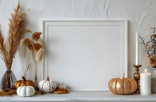 White Framed Canvas Mockup With Pumpkins and Dried Flowers on Mantel photo