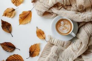 A Cozy Autumn Morning With a Cup of Latte and a Knit Blanket photo