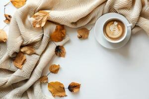 A Cozy Autumn Morning With a Cup of Latte and a Knit Blanket photo