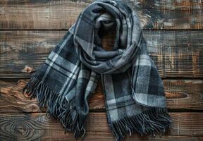 Black And White Plaid Scarf With Tassels On Rustic Wood photo