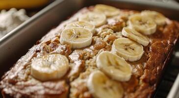Freshly Baked Banana Bread With Sliced Banana Topping photo