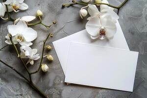 White Orchid Flower on Stack of Paper With Linen Fabric photo