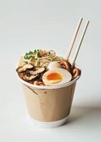 Delicious Takeout Noodle Soup With Egg, Mushrooms, and Green Onions photo