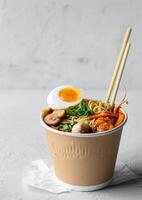Delicious Takeout Noodle Soup With Egg, Mushrooms, and Green Onions photo