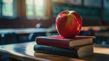 Red Apple on Top of Books in Empty Classroom photo