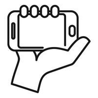 Hand holding smartphone outline icon vector