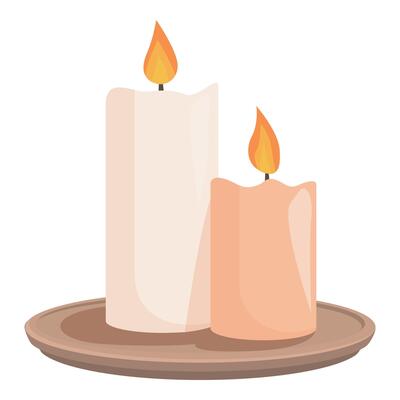 Two lit candles burning on a wooden plate creating a romantic atmosphere