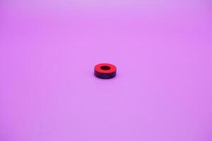circle magnet isolated on purple background photo