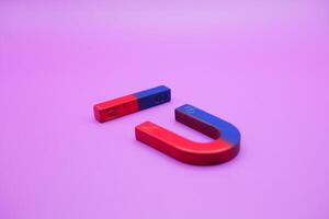 horseshoe magnets and bar magnets isolated on a purple background photo