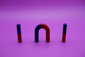 various shapes of magnets isolated on a purple background photo
