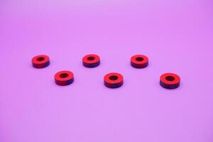 circle magnet isolated on purple background photo