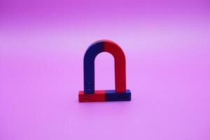 horseshoe magnets and bar magnets isolated on a purple background photo