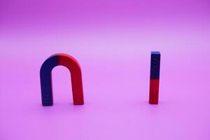 horseshoe magnets and bar magnets isolated on a purple background photo