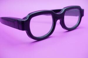 sunglasses isolated on purple background. sunglasses with curved frames and transparent glass. photo
