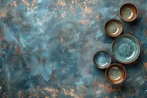 Blue And Brown Ceramic Bowls On A Rustic Blue Background photo