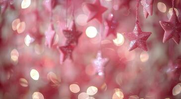 Pink Star Ornaments Hanging On Christmas Tree photo