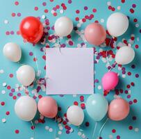 White Card Surrounded by Colorful Balloons and Confetti on Blue Background photo