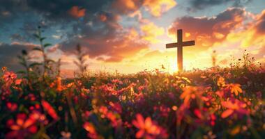Wooden Cross Standing in a Field of Flowers at Sunset photo