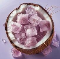 Pink Coconut Ice Cubes on Lavender Background photo