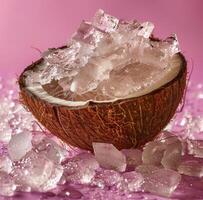 Crushed Ice In A Coconut Shell On Pink Background photo