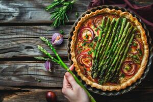 Asparagus and Onion Quiche on Rustic Wooden Table photo