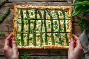Asparagus and Onion Quiche on Rustic Wooden Table photo