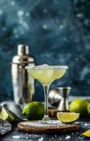 A Classic Margarita Cocktail With Lime Wedge and Salt Rim on a Wooden Board photo