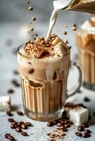 Iced Coffee With Marshmallows and Whipped Cream Being Poured in a Glass photo