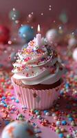 A Single Birthday Cupcake With Sprinkles and a Candle photo