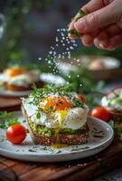 Poached Egg and Avocado Toast With Salt Sprinkle photo