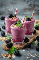 Fresh Blackberry Smoothies With Oatmeal and Mint Garnish photo